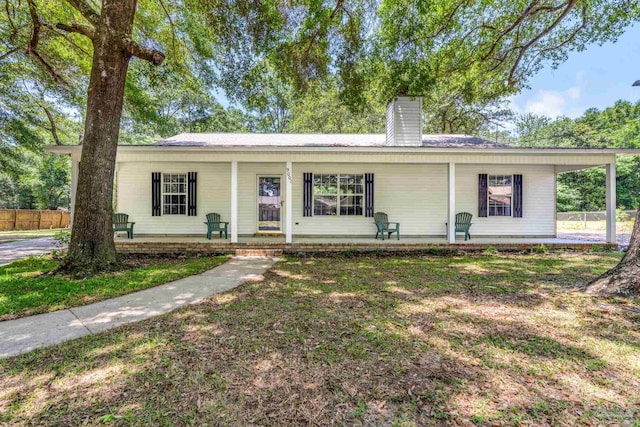 9001 Thompson Dr, Pensacola, FL 32534 - single story home with a porch, a chimney, and fence