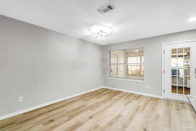 9001 Thompson Dr, Pensacola, FL 32534 - empty room with baseboards and wood finished floors