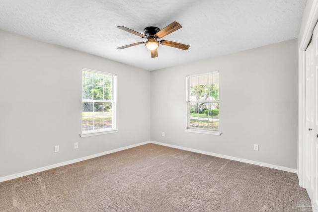 9001 Thompson Dr, Pensacola, FL 32534 - empty room with ceiling fan, carpet floors, baseboards, and a textured ceiling