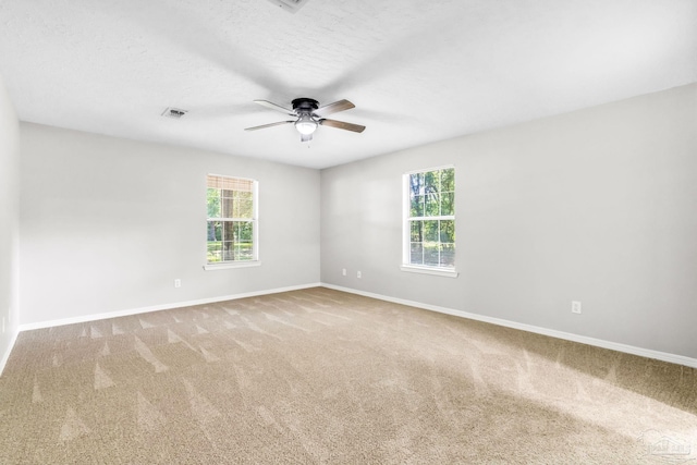 9001 Thompson Dr, Pensacola, FL 32534 - unfurnished room featuring ceiling fan, baseboards, and carpet flooring