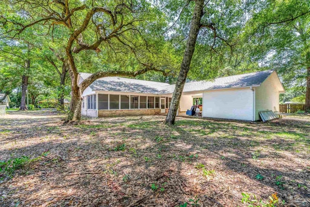 9001 Thompson Dr, Pensacola, FL 32534 - rear view of property with a sunroom