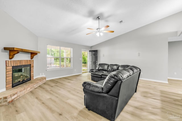 9001 Thompson Dr, Pensacola, FL 32534 - living room featuring ceiling fan, lofted ceiling, light wood-style flooring, baseboards, and a brick fireplace