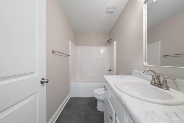 bathroom with tile patterned floors, toilet, a textured ceiling, baseboards, and vanity