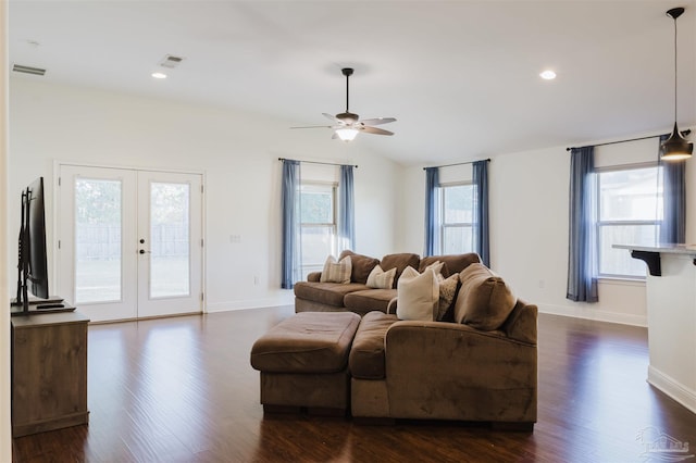 living room featuring ceiling fan, french doors, dark wood-type flooring, and vaulted ceiling