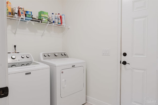 laundry room featuring washer and clothes dryer