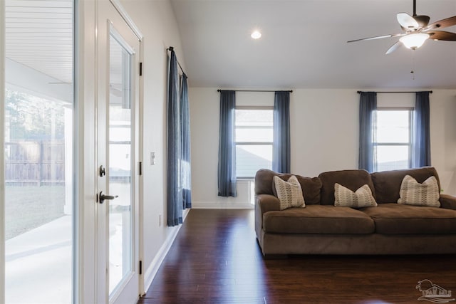 living room with ceiling fan, a healthy amount of sunlight, and dark hardwood / wood-style flooring