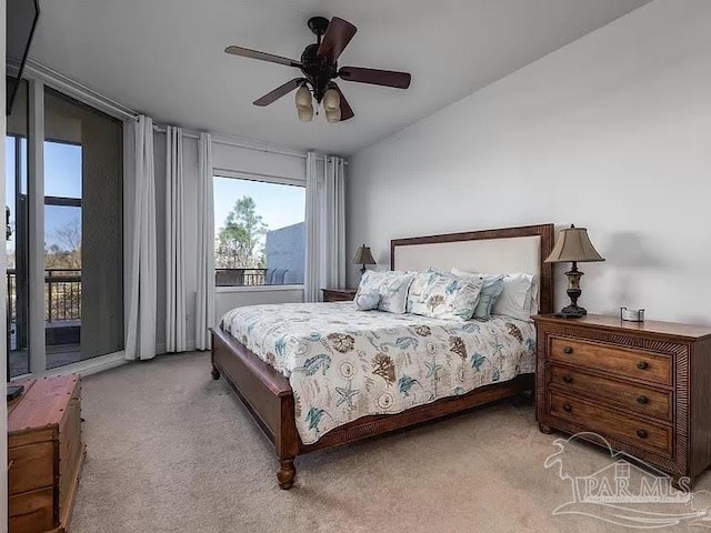 carpeted bedroom featuring ceiling fan, lofted ceiling, and access to outside