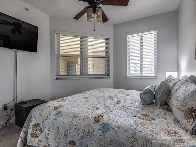 carpeted bedroom with ceiling fan