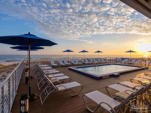 pool at dusk with a water view