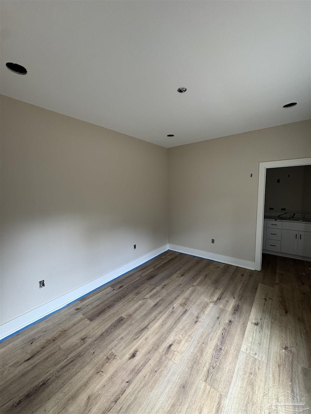 unfurnished room featuring light hardwood / wood-style flooring