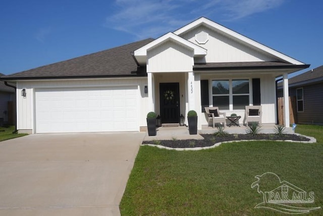 4422 Tiger Oak Ct, Pace, FL 32571 - single story home featuring a porch, driveway, a garage, a front yard, and a shingled roof