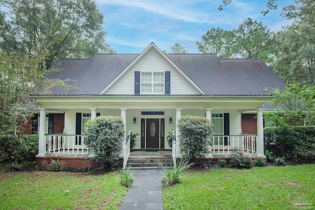 view of front of home with a front yard and a porch