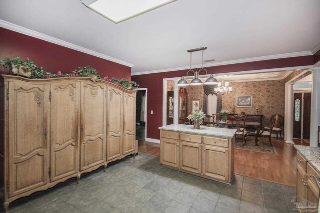 kitchen featuring pendant lighting, a center island, an inviting chandelier, hardwood / wood-style floors, and crown molding