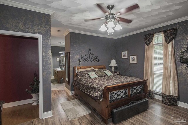 bedroom featuring ornamental molding, ceiling fan, and hardwood / wood-style flooring