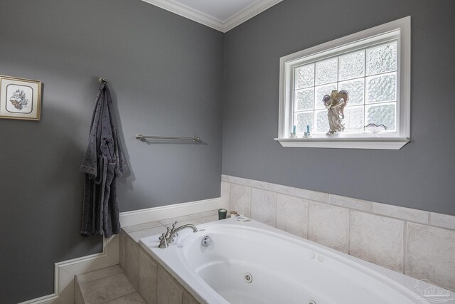 bathroom with tiled tub and ornamental molding