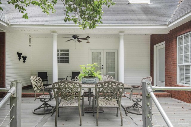 view of front of property with a patio, a front yard, a wooden deck, and a fire pit