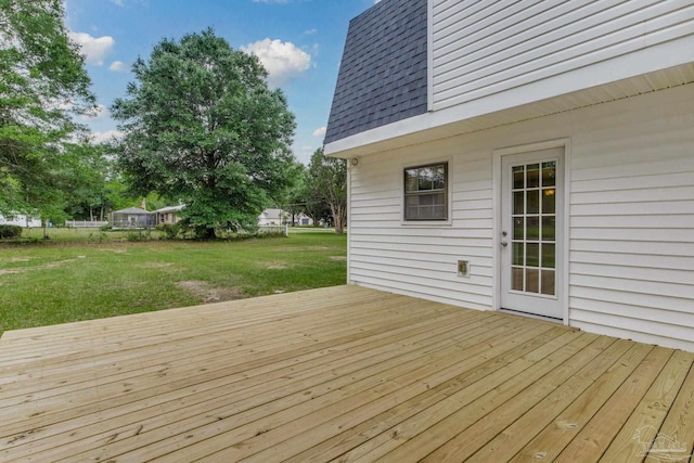 wooden deck with a yard