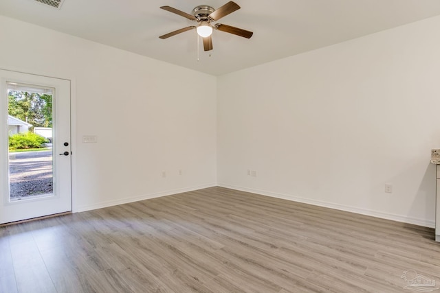 unfurnished room featuring light hardwood / wood-style flooring and ceiling fan