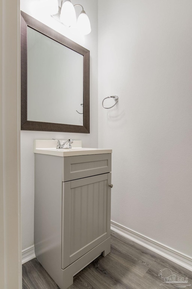 bathroom featuring vanity and wood-type flooring