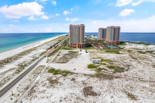 aerial view featuring a water view and a beach view