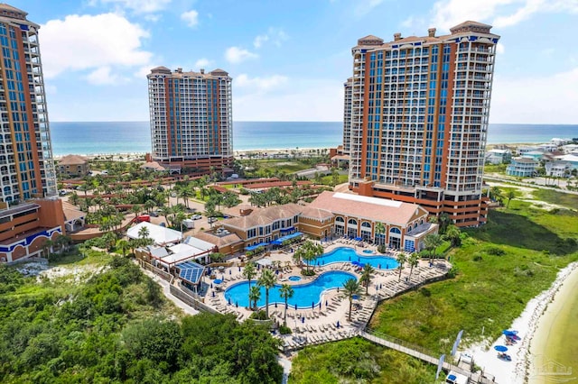 bird's eye view with a water view and a beach view