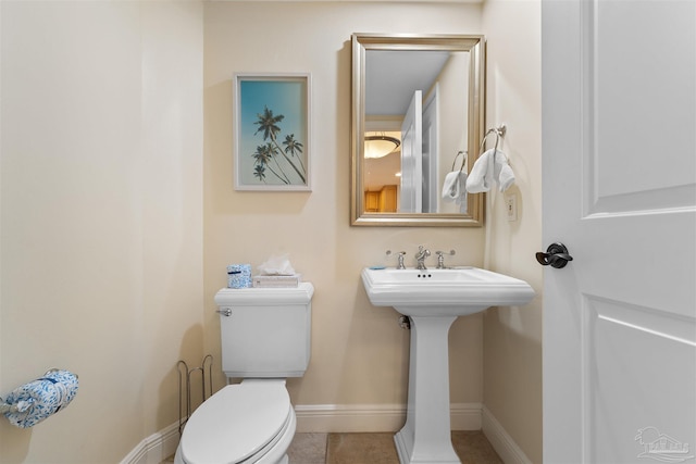 bathroom with tile patterned floors and toilet