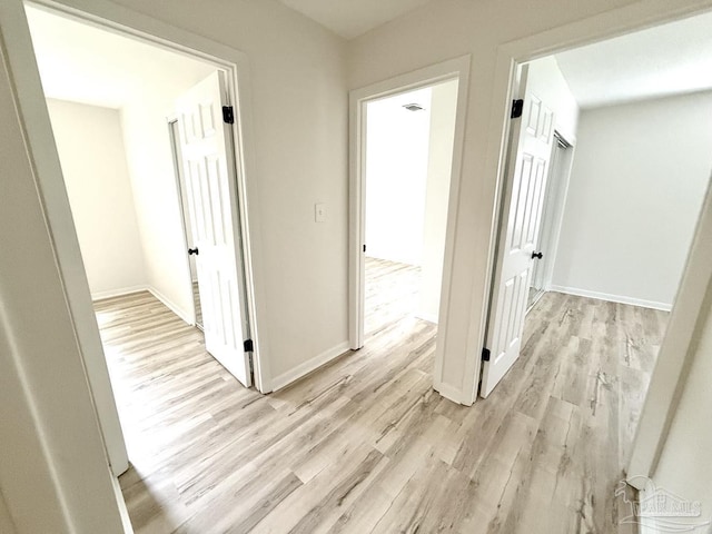 20 Magnolia Ave, Shalimar, FL 32579 - hallway featuring light wood-style flooring and baseboards