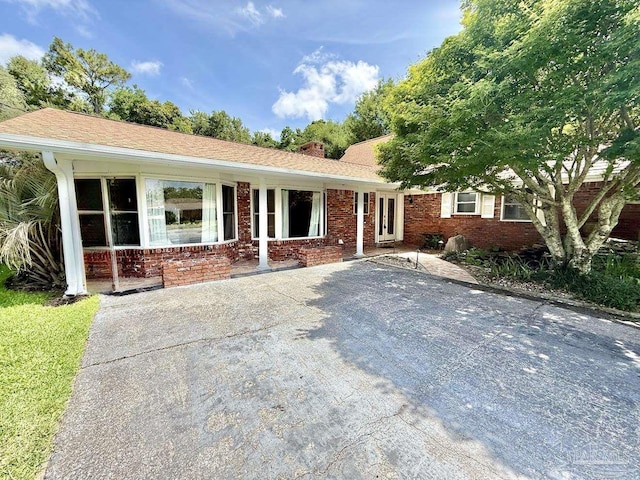 20 Magnolia Ave, Shalimar, FL 32579 - single story home with brick siding and a chimney