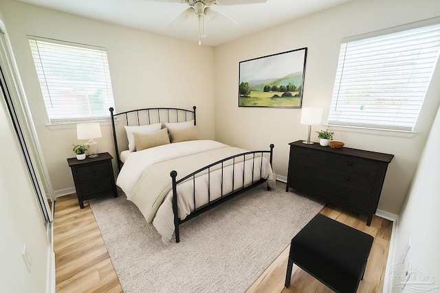 20 Magnolia Ave, Shalimar, FL 32579 - bedroom with light wood finished floors and ceiling fan