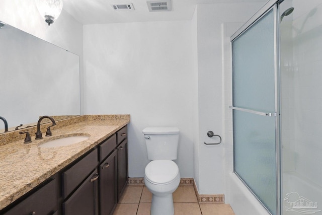 20 Magnolia Ave, Shalimar, FL 32579 - full bathroom featuring vanity, tile patterned floors, and bath / shower combo with glass door