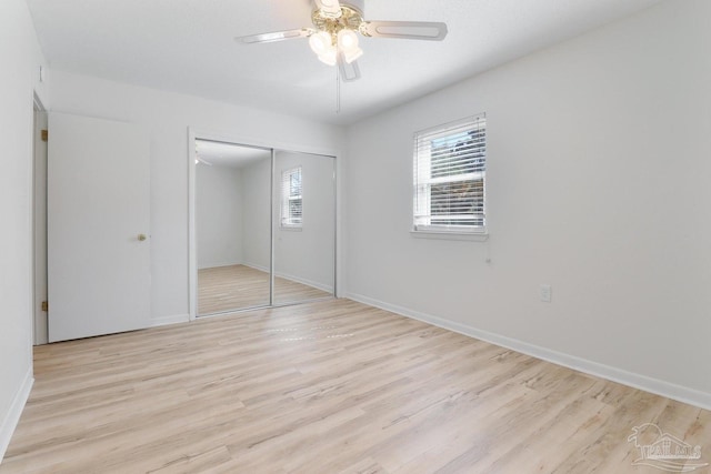 20 Magnolia Ave, Shalimar, FL 32579 - unfurnished bedroom with multiple windows, light wood finished floors, and a closet