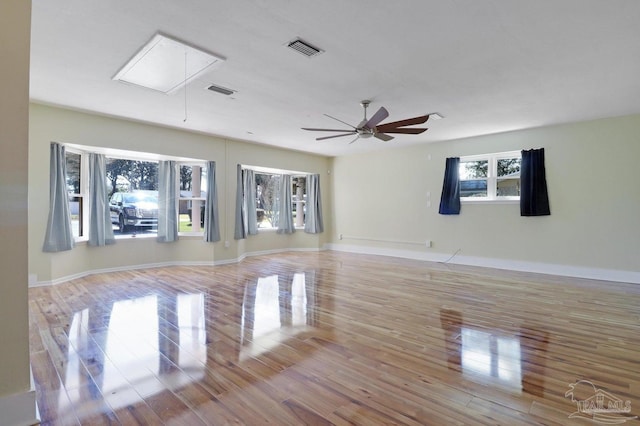 20 Magnolia Ave, Shalimar, FL 32579 - empty room with attic access, wood finished floors, and ceiling fan