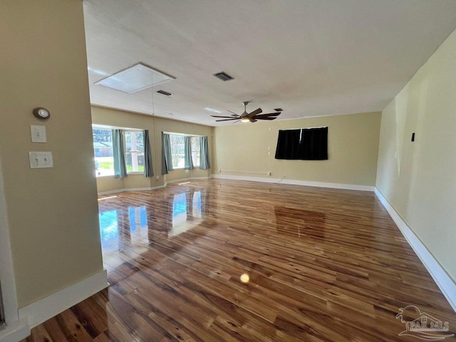 20 Magnolia Ave, Shalimar, FL 32579 - empty room with attic access and wood finished floors