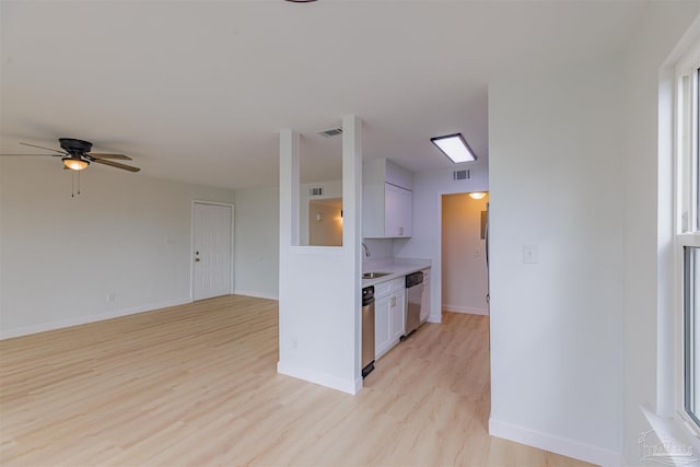 kitchen with sink, white cabinetry, dishwasher, ceiling fan, and light hardwood / wood-style floors