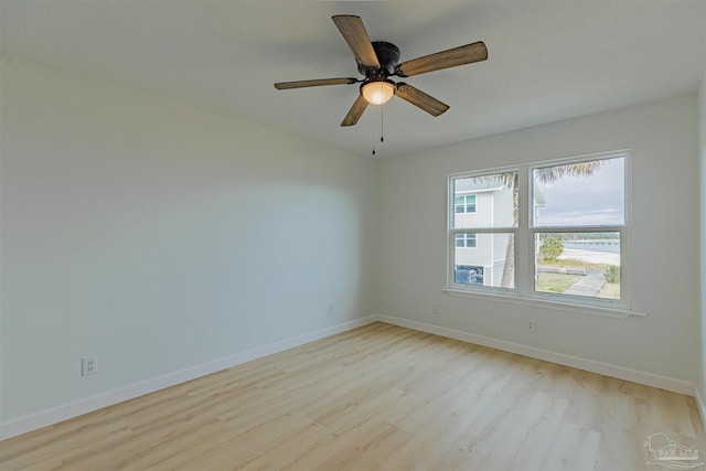 empty room featuring ceiling fan and light hardwood / wood-style floors