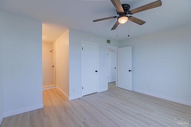 unfurnished bedroom with ceiling fan and light hardwood / wood-style flooring