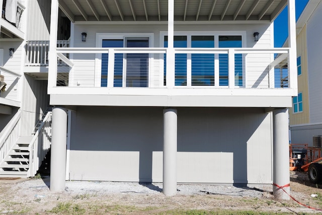 view of side of home with central AC