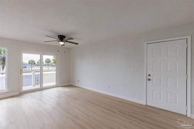 unfurnished room featuring ceiling fan and light wood-type flooring