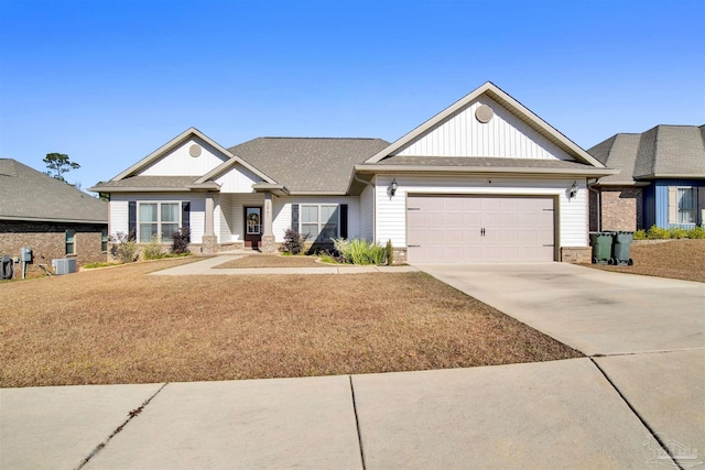 craftsman-style home with a front yard, a garage, and central AC