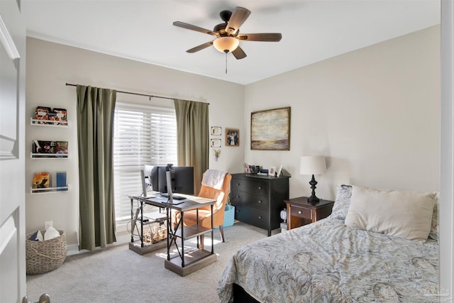 bedroom featuring ceiling fan and light carpet