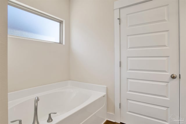 bathroom with a washtub