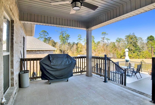 view of patio with ceiling fan, a grill, and a wooden deck