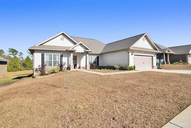 view of front of home featuring a front yard and a garage