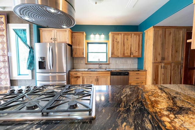 431 E Zarragossa St Unit B, Pensacola, FL 32502 - kitchen featuring appliances with stainless steel finishes, a sink, backsplash, dark stone countertops, and range hood