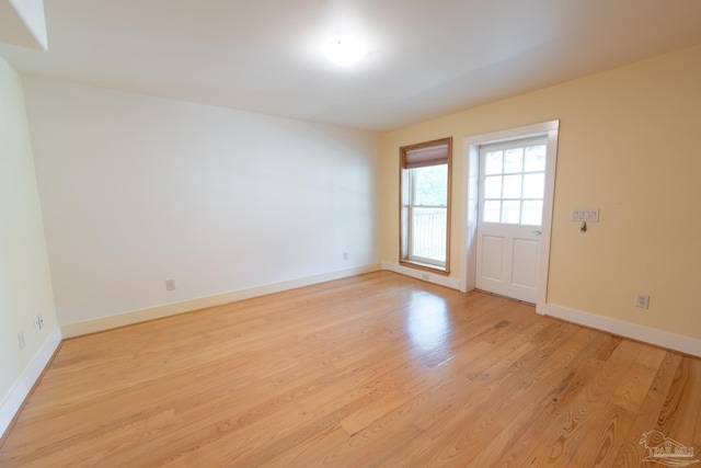 431 E Zarragossa St Unit B, Pensacola, FL 32502 - spare room featuring light wood finished floors and baseboards