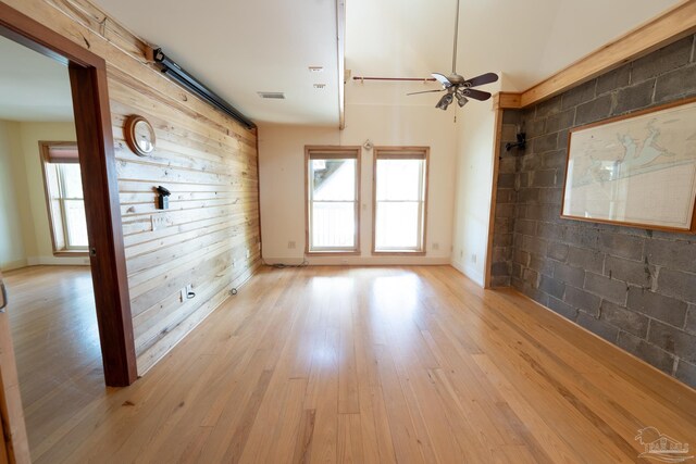 431 E Zarragossa St Unit B, Pensacola, FL 32502 - empty room with ceiling fan, healthy amount of natural light, light wood-style flooring, and baseboards