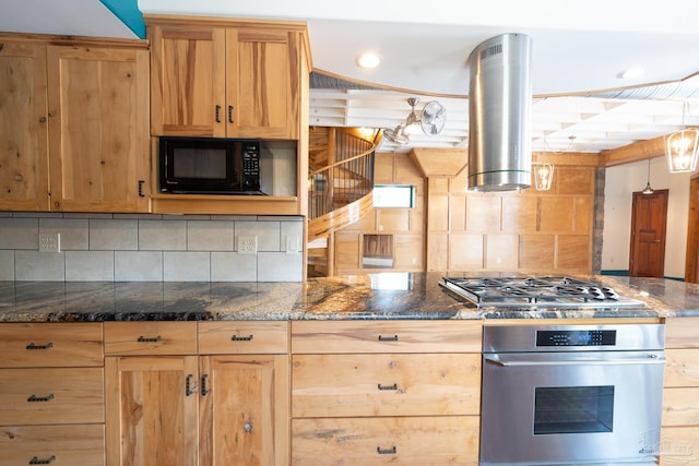 431 E Zarragossa St Unit B, Pensacola, FL 32502 - kitchen with stainless steel appliances, island exhaust hood, backsplash, and dark stone countertops