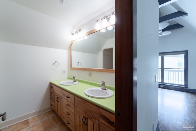 431 E Zarragossa St Unit B, Pensacola, FL 32502 - full bathroom with lofted ceiling, double vanity, and baseboards