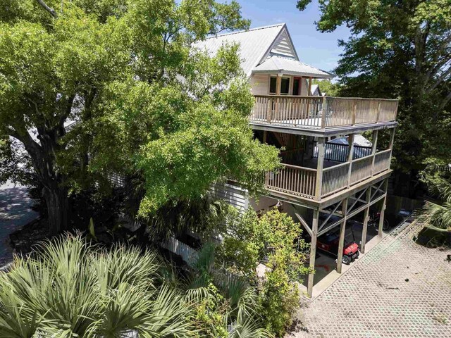 431 E Zarragossa St Unit B, Pensacola, FL 32502 - rear view of property with a deck and metal roof