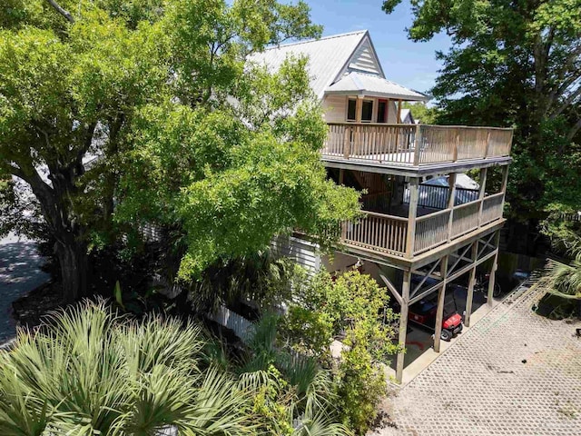 431 E Zarragossa St Unit B, Pensacola, FL 32502 - back of house featuring a wooden deck and metal roof